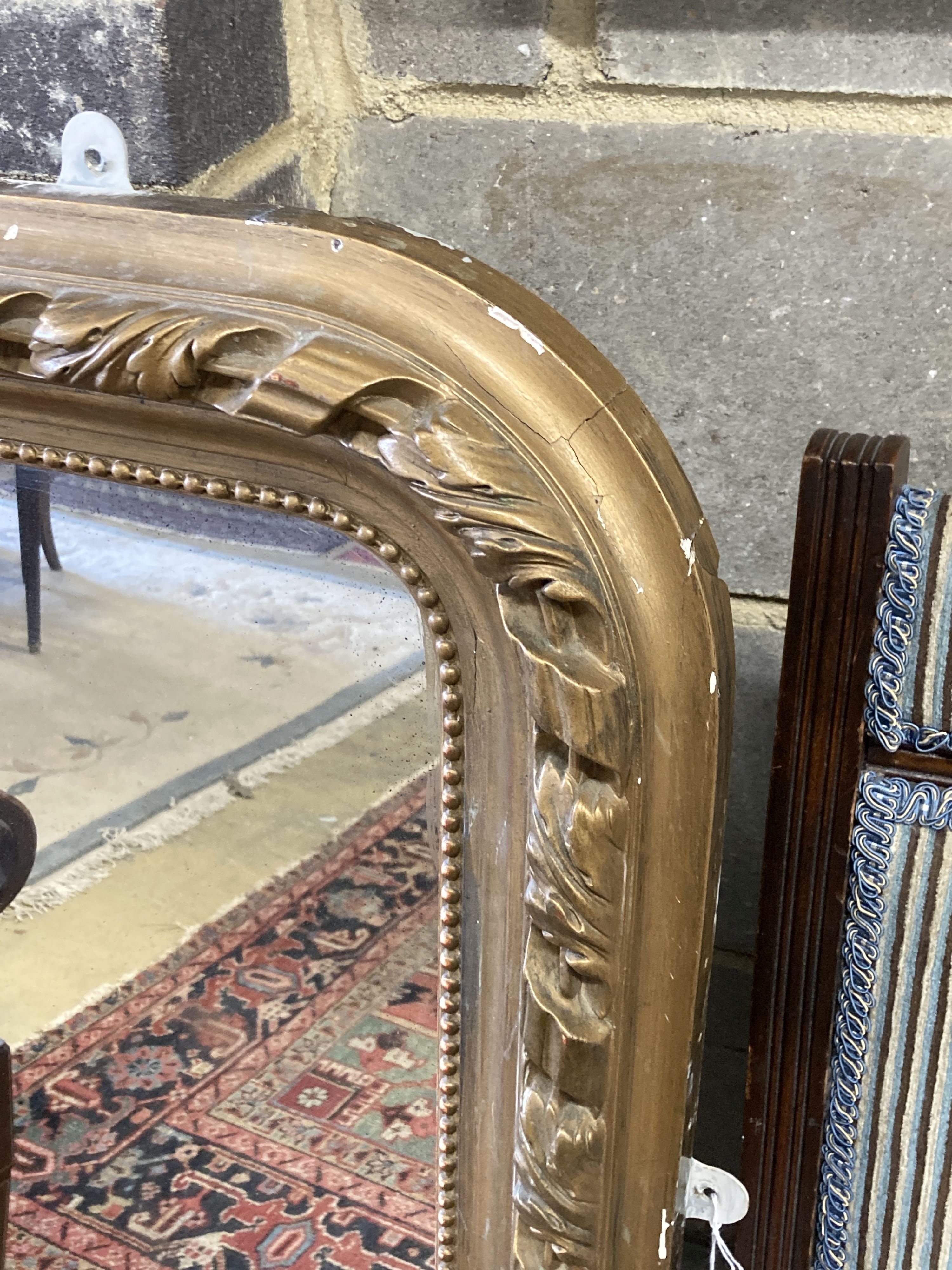 A Victorian arched giltwood overmantel mirror, width 80cm, height 118cm